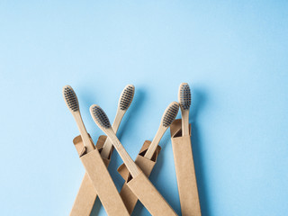 Bamboo biodegradable toothbrushes on blue