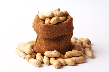  raw peanuts in shell on white background