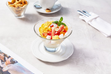 Fruit salad on a plate on the table