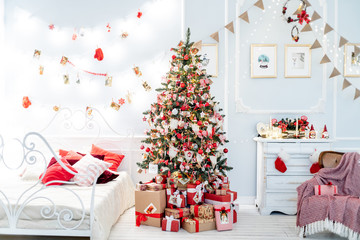 Christmas living room with a christmas tree and presents under it
