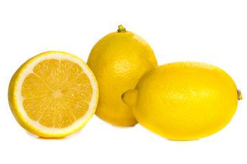 two lemons whole and one cut to half of the isolate on a white background without a shadow, macro....