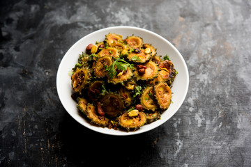 Cooked bitter Melon/gourd or Karela Sabzi served in a bowl. Scientific name of this healthy vegetable is Momordica charantia. selective focus