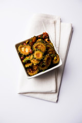 Cooked bitter Melon/gourd or Karela Sabzi served in a bowl. Scientific name of this healthy vegetable is Momordica charantia. selective focus