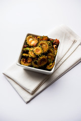 Cooked bitter Melon/gourd or Karela Sabzi served in a bowl. Scientific name of this healthy...
