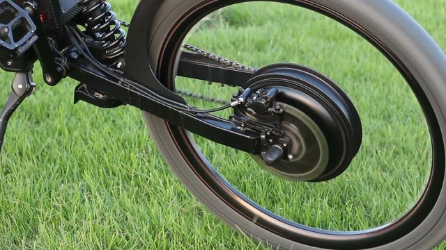 Close up of spinning motor electric bike. Ebike bicycle environmentally friendly eco e-mountainbike transport. Healthy lifestyle