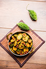 Cooked bitter Melon/gourd or Karela Sabzi served in a bowl. Scientific name of this healthy vegetable is Momordica charantia. selective focus