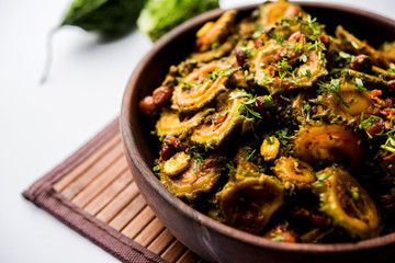 Cooked bitter Melon/gourd or Karela Sabzi served in a bowl. Scientific name of this healthy...