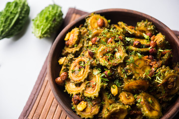 Cooked bitter Melon/gourd or Karela Sabzi served in a bowl. Scientific name of this healthy vegetable is Momordica charantia. selective focus