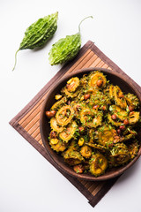 Cooked bitter Melon/gourd or Karela Sabzi served in a bowl. Scientific name of this healthy...