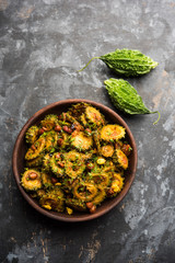 Cooked bitter Melon/gourd or Karela Sabzi served in a bowl. Scientific name of this healthy...