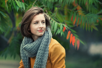 Portrait of a young girl in autumn