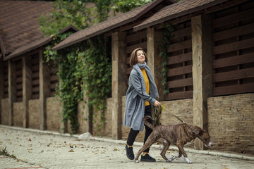 Girl walking with a dog