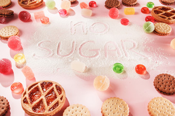 Sugar free cakes and marmalades . Diet food. Top view on pink table background. Healthy concept.