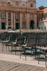 St. Peter's Square in the Vatican on a sunny day. Architecture and many chairs