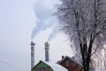 heating plant pipes with a smoke on winter day