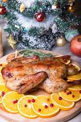 Christmas duck with oranges and cranberries whole baked. Close-up, selective focus.