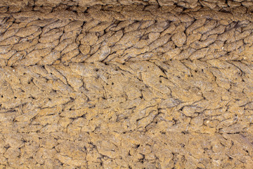 old antique clay wall, mud hut, cracked clay