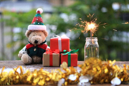 Selective focus of sparklers and gift box for Christmas and New Year's Day or Greeting season