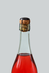 Red wine bottle with cork and muselet