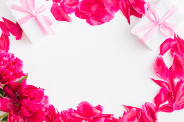 Valentines day composition with red peonies and gift box on a light background
