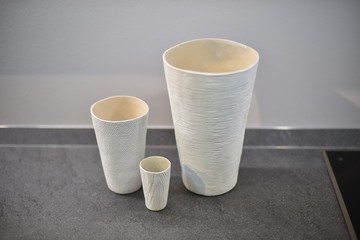 white paper cups on table