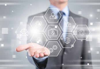 Business and technology concept. Man touching business elements