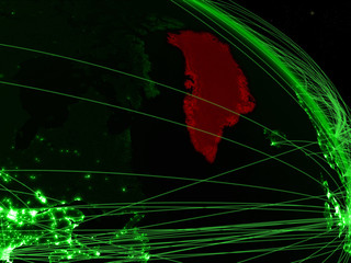 Greenland from space on model of green planet Earth with network. Concept of green technology, connectivity and travel.