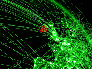 Ireland from space on model of green planet Earth with network. Concept of green technology, connectivity and travel.
