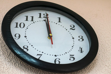 wall clock shows exactly twelve hours