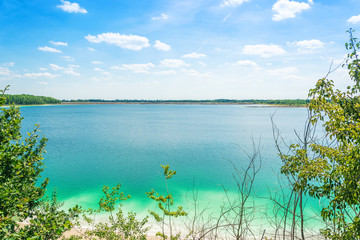 horizontal landscape of blue lake on summer time