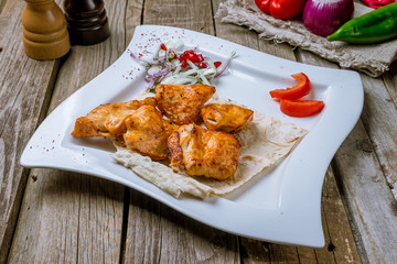 chicken kebab on board