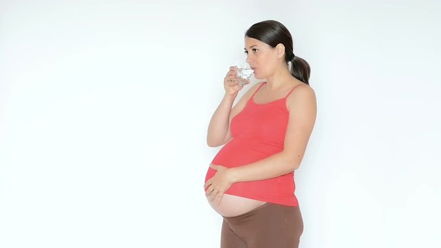 Pregnant Woman Taking a Pill