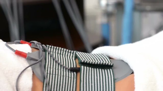 Beautiful Woman getting Electrostimulation Therapy