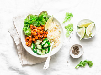 Detox moroccan spiced chickpea glow bowl on a light background, top view. Vegetarian food concept