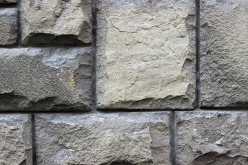 Facade wall stone grey gray surface texture close up