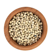 Top view of  pepper in wooden bowl on white background