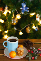blue tea mug, tangerines and ginger cookies