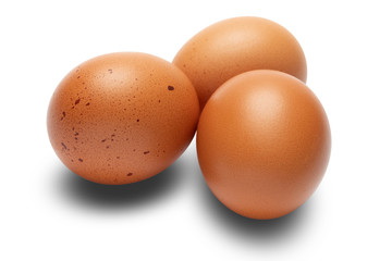 brown chicken eggs closeup isolated on white background
