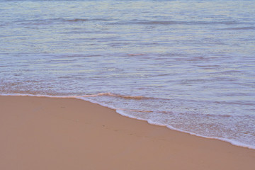 Ocean waves on the tropical beach.