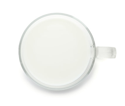 Glass cup with fresh milk on white background, top view