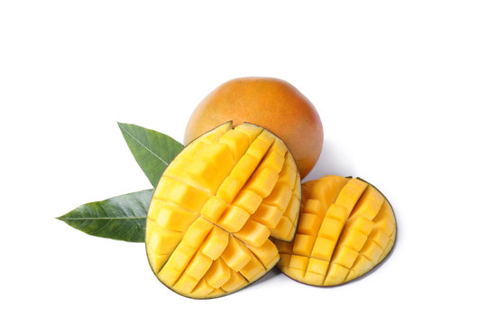 Fresh juicy mango and leaves isolated on white