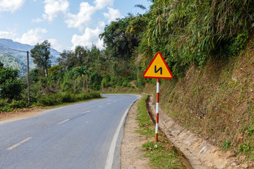 sign winding road on a mountain road Vietnam, Traffic Sign