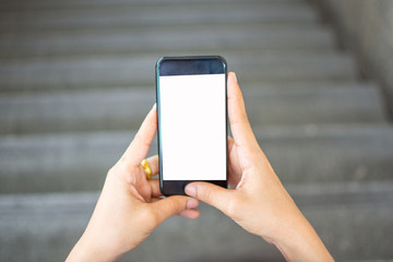 woman's hand holding smart phone with blur background. selective focus and soft focus.