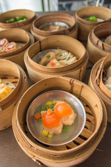 dim sum in bamboo steamer, chinese cuisine.