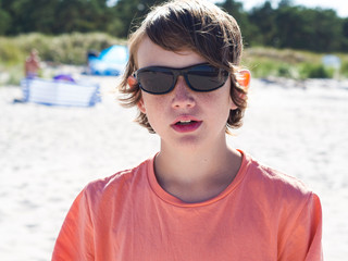 Portrait of a teenager boy at the beach.