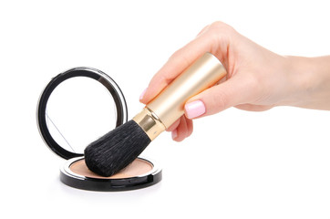 Blush powder with brush in hand on a white background. Isolation