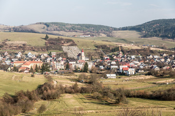Fototapeta na wymiar Papradno village with smaller hills of Javorniky mountains on the background in Slovakia during nice autumn day