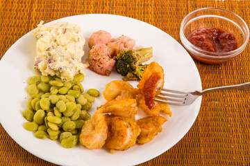 Tempura Battered Shrimp dipped in Cocktail Sauce with Beans and Potato Salad