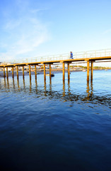 Footbridge of the pier in the fishing port of El Rompido, beaches of Huelva, Andalusia, Spain