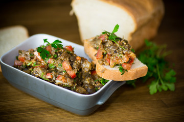 eggplant caviar with tomatoes and a slice of bread